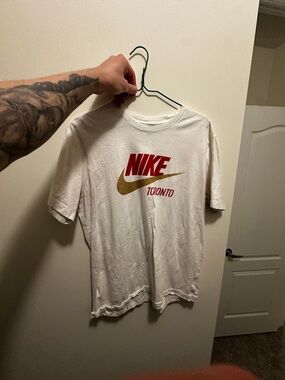 Nike White Short Sleeve Tee with Red Logo and Gold Swoosh